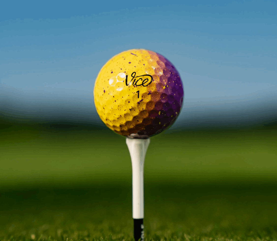 Twaalf Thom's Golfgear Vice Pro Royal Gold golfballen in een doos, met gele en blauwe branding en logo op de ballen